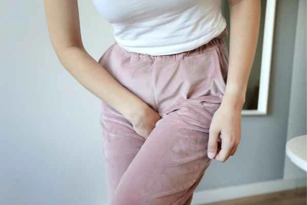 woman running for the toilet because of urinary incontinence Port Glasgow
